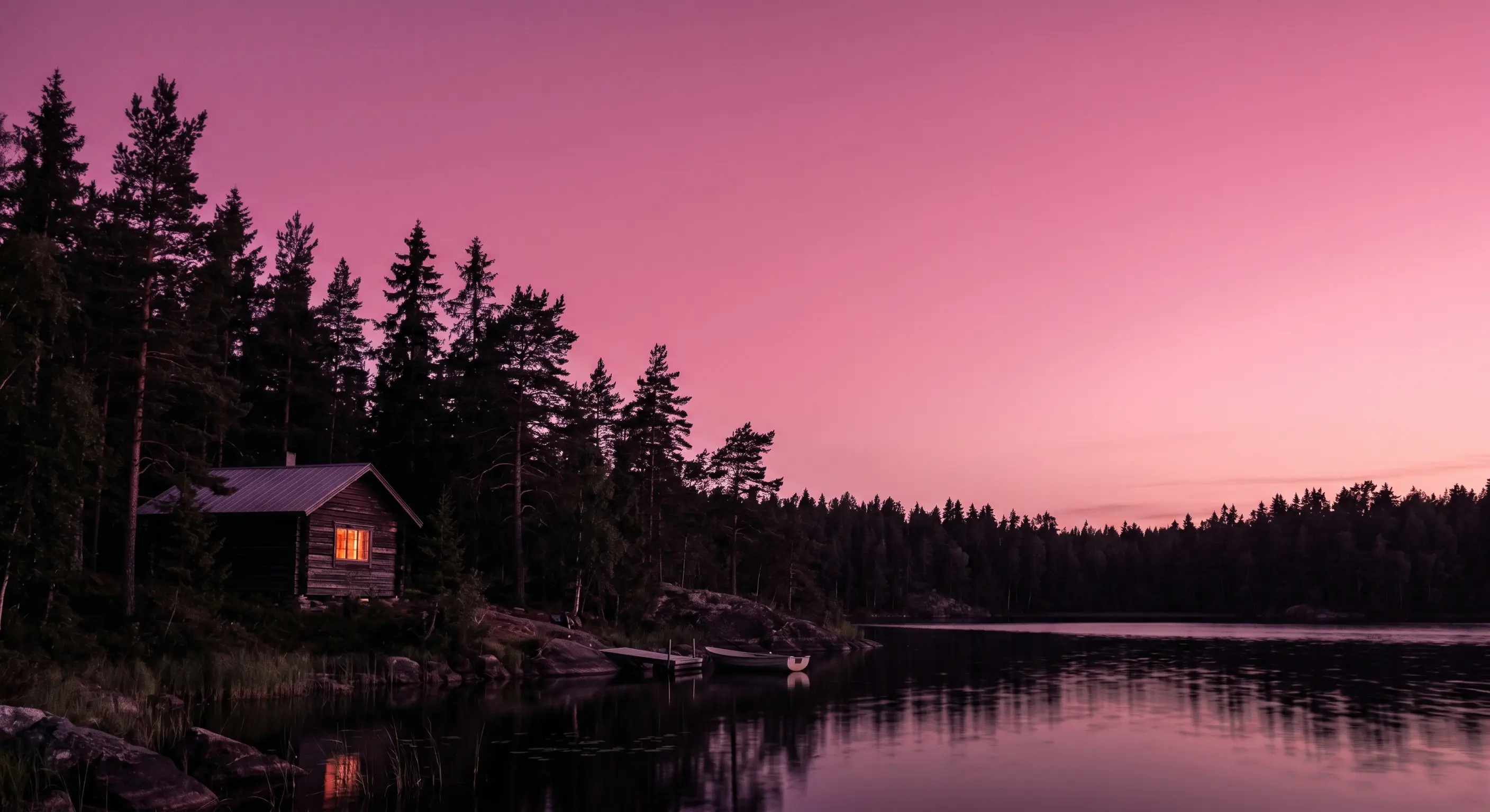 A single snow-covered cabin glowing softly in a silent alpine valley at dusk